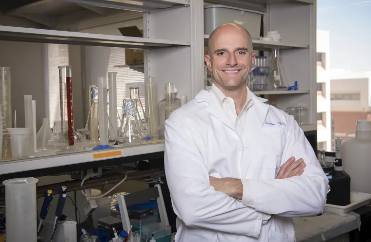 portrait of john streicher in research lab