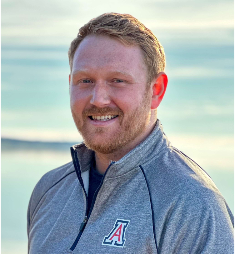 portrait of Christopher Cartmell wearing University of Arizona quarter-zip shirt